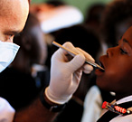 Teeth examination being performed at a school in the outback by the staff of the Colgate Mobile Dental Clinic, part of the Health Train 